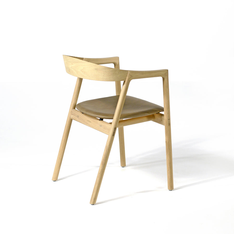 Gazzda Muna Chair in solid Oak and Dakar Leather Stone, back turned | © Spencer Interiors
