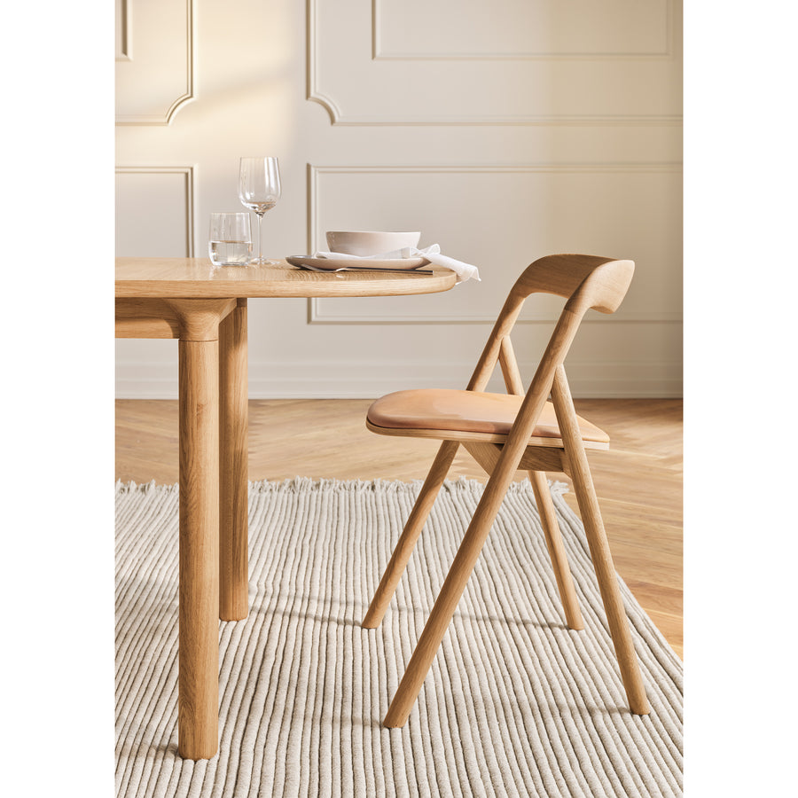 BOLIA Fenri Dining Chair in Oiled Oak and leather, ambient setting, profile
