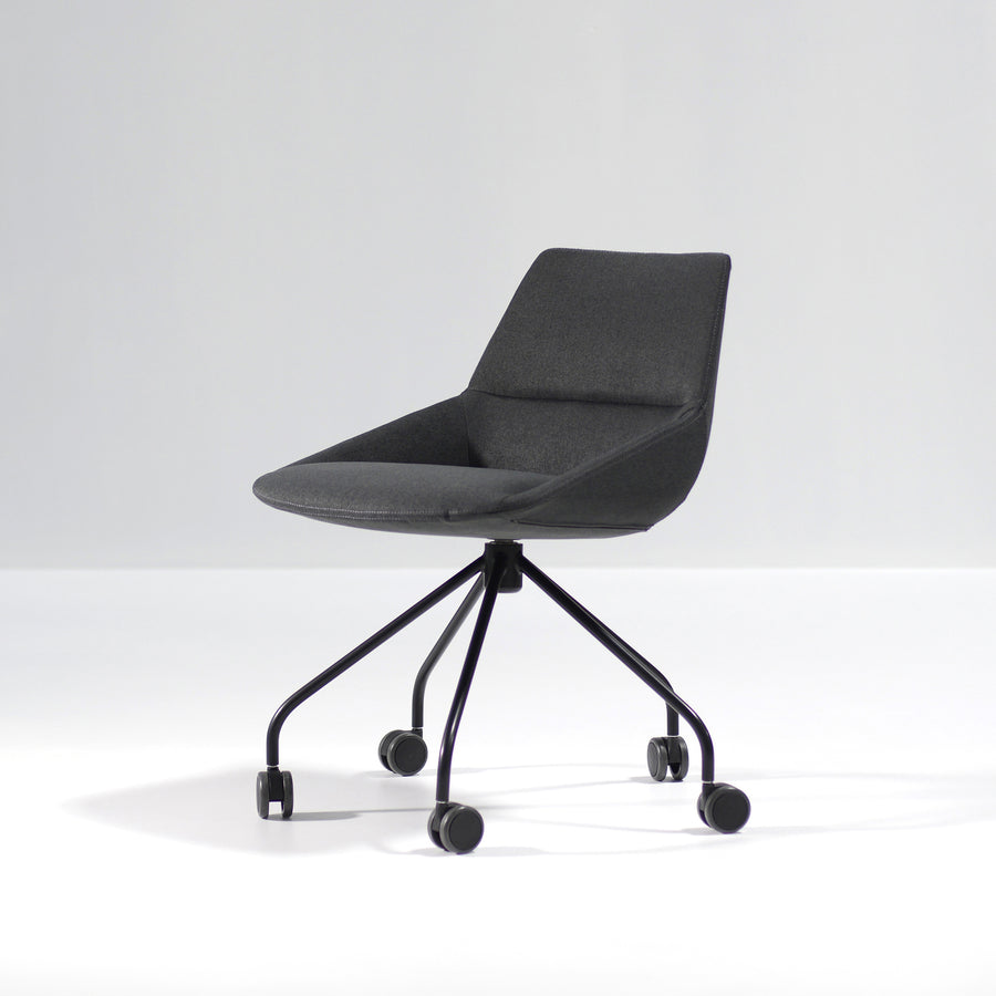Inclass Dunas XS Swivel Trestle Base Armchair with Castors, front turned, © Spencer Interiors Inc.