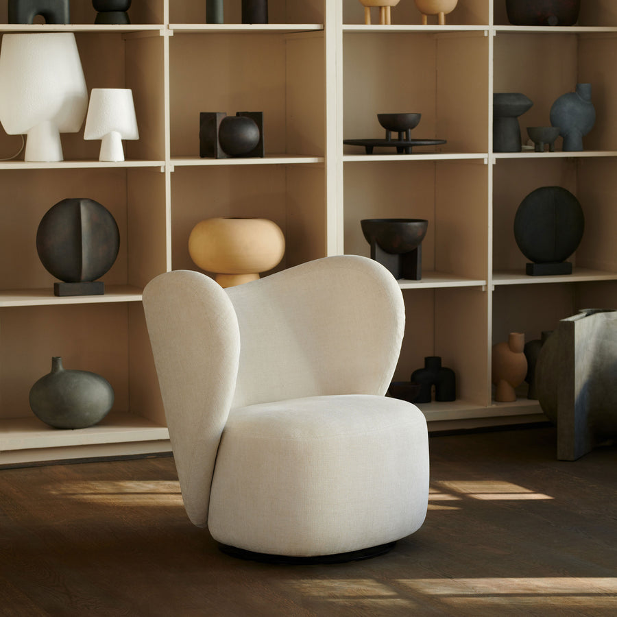 Norr11 Denmark, The Little Big Swivel Chair,  ambient with bookshelf | Spencer Interiors
